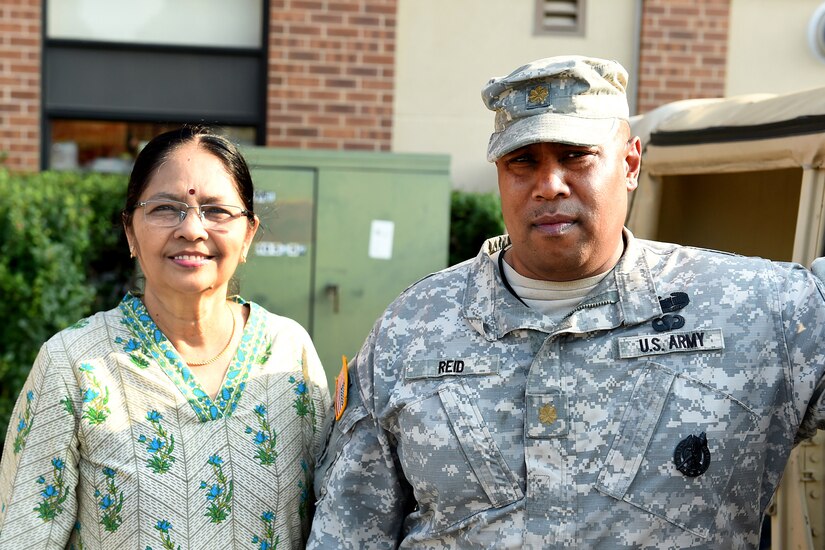 Sukanya Narayan, left, India, pauses for a photo with Army Reserve Maj. Lawrence Reid, Resource Management Officer, 85th Support Command, next to a Humvee during the Arlington Heights’ National Night Out community police event, August 2, 2016. Narayan asked to take a photo with Reid to send to her brother in India who served in India’s army. Narayan said she respects those who wear the uniform and serve their country.
(U.S. Army photo by Sgt. Aaron Berogan/Released)