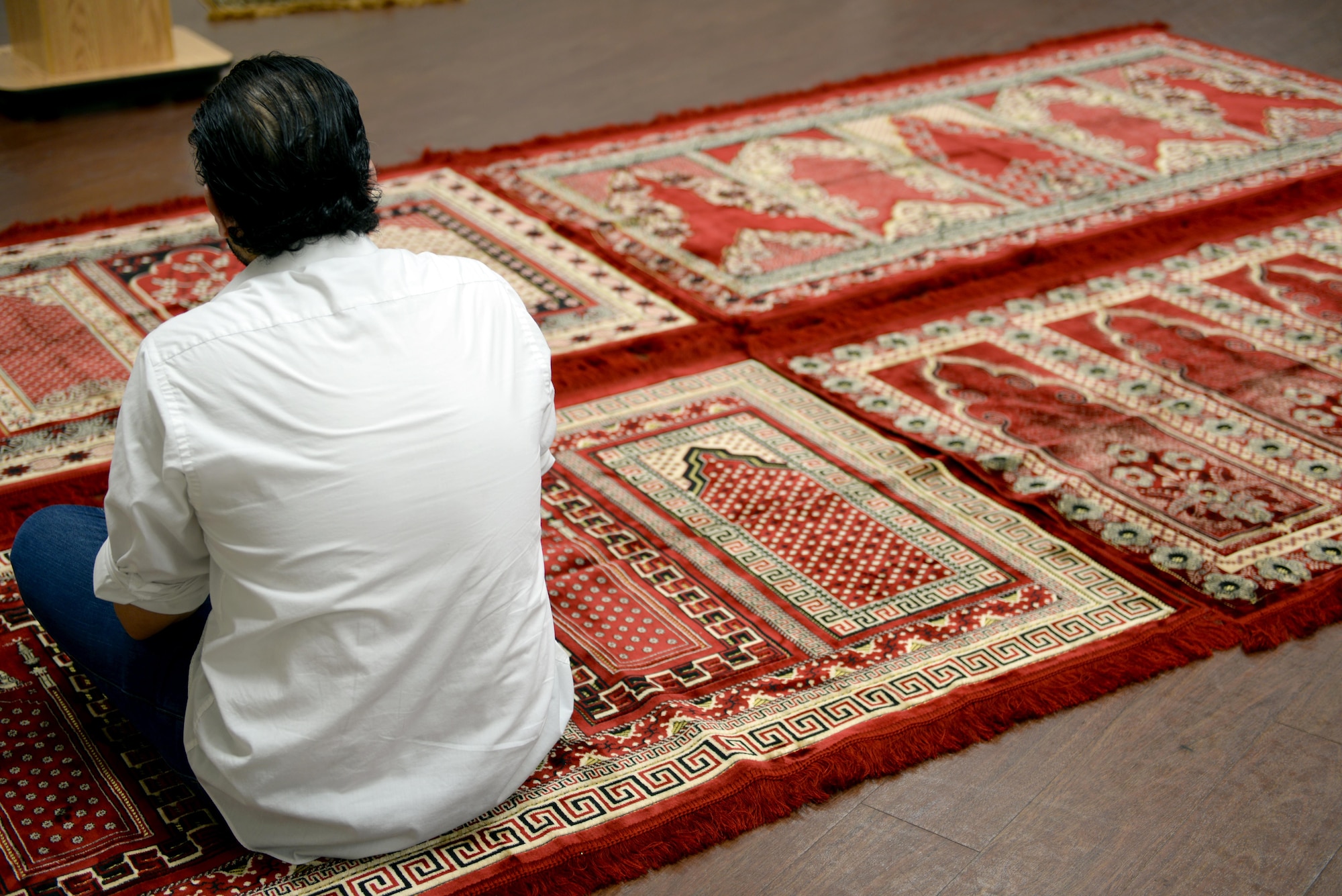 A man sits in prayer before the first Muslim religious service offered on Maxwell Air Force Base, Ala., July 29, 2016. The Muslim worship service will take place every other Friday beginning Aug. 5, at 12:30 p.m. and is open to all individuals with base access. (U.S. Air Force photo/Senior Airman Tammie Ramsouer)