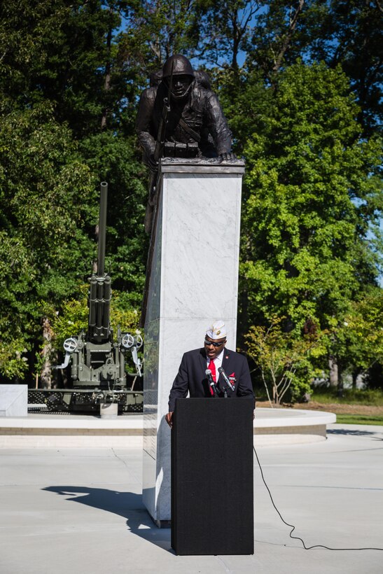 Forest E. Spencer, Jr., National President of the Montford Point Marine Association, delivers the closing remarks at the Montford Point Marine Memorial Dedication at Marine Corps Base Camp Lejeune July 29. Hundreds of attendees, including Montford Point Marines, family members, active duty servicemembers and supporters, gathered to attend the memorial dedication which honored the 20,000 segregated African-American Marines who trained there in the 1940s. (U.S. Marine Corps photo by Lance Cpl. Sean J. Berry/Released)