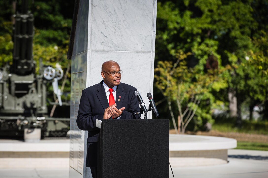 Retired Brig. Gen. Johnny R. Thomas recognizes the Montford Point Marines during the keynote address at the Montford Point Marine Memorial Dedication at Marine Corps Base Camp Lejeune July 29. Hundreds of attendees, including Montford Point Marines, family members, active duty servicemembers and supporters, gathered to attend the memorial dedication which honored the 20,000 segregated African-American Marines who trained there in the 1940s. (U.S. Marine Corps photo by Lance Cpl. Sean J. Berry/Released)