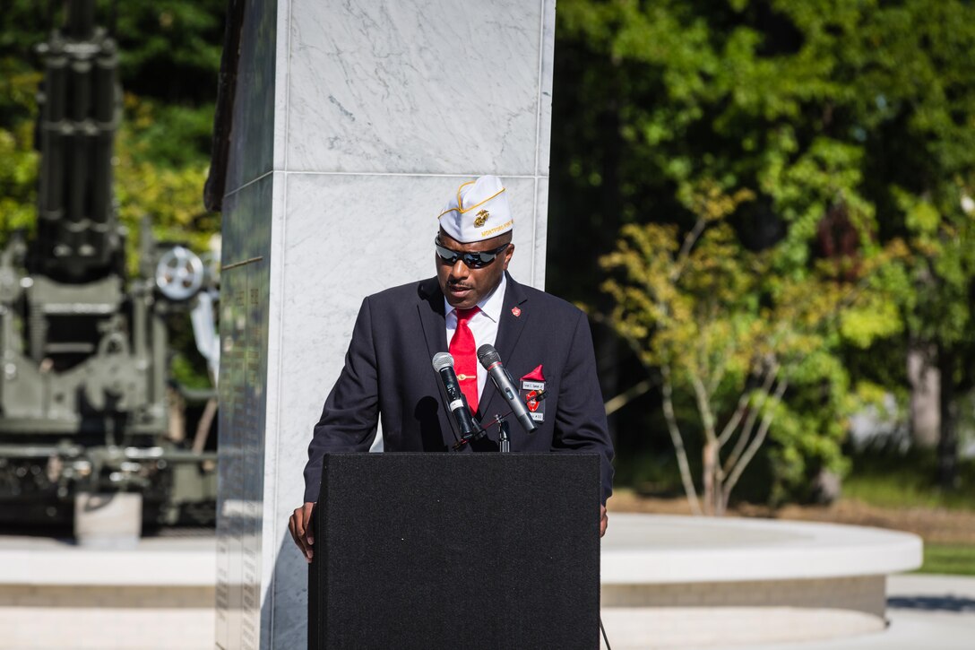 Forest E. Spencer, Jr., National President of the Montford Point Marine Association, delivers remarks at the Montford Point Marine Memorial Dedication at Marine Corps Base Camp Lejeune July 29. Hundreds of attendees, including Montford Point Marines, family members, active duty servicemembers and supporters, gathered to attend the memorial dedication which honored the 20,000 segregated African-American Marines who trained there in the 1940s. (U.S. Marine Corps photo by Lance Cpl. Sean J. Berry/Released)