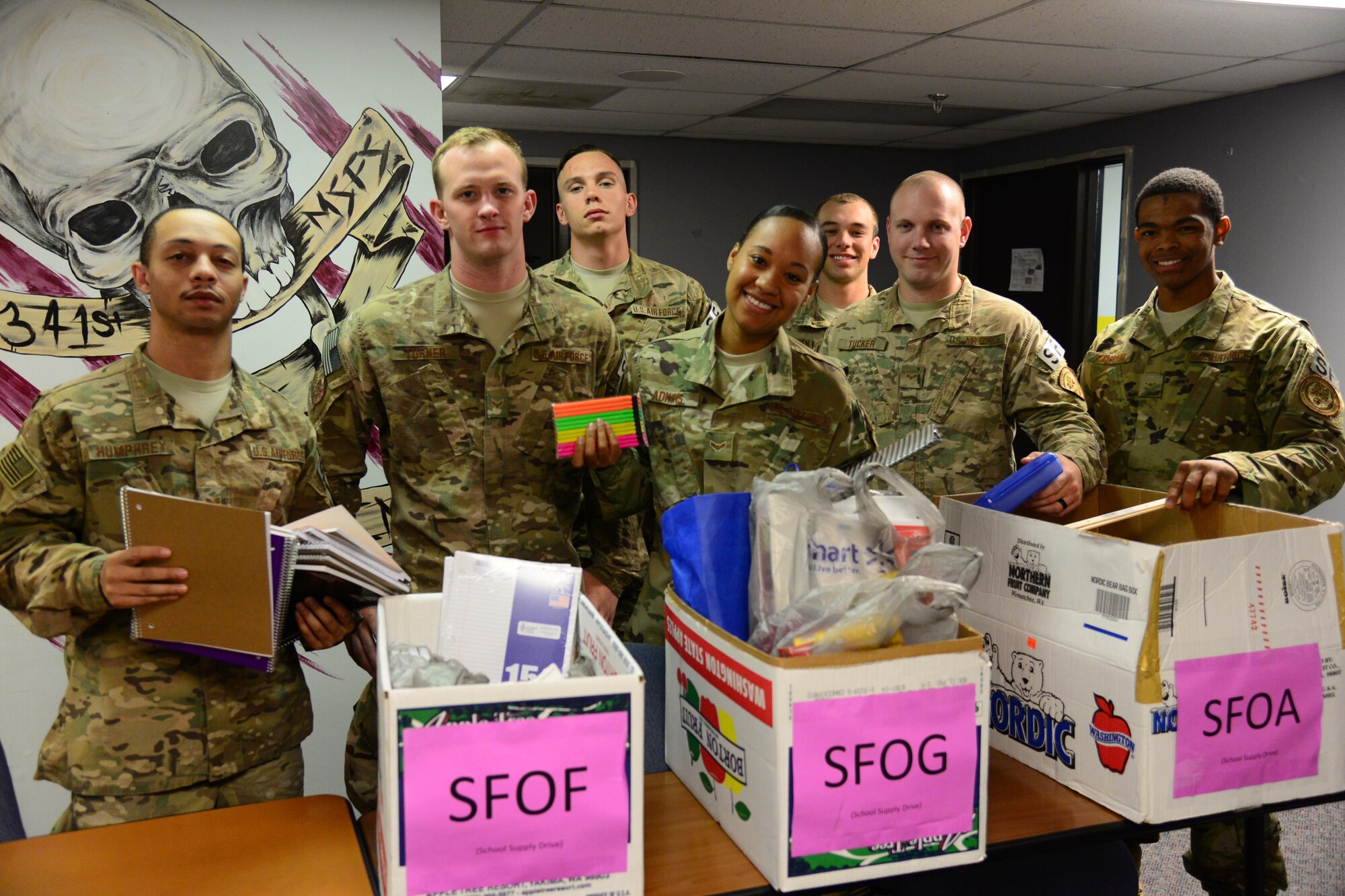 Airmen assigned to the 341st Missile Security Forces Squadron gulf flight, organize donated back-to-school items Aug. 4, 2016, at Malmstrom Air Force Base, Mont. The 341st MSFS held a donation drive for back-to-school supplies to assist families with children for the upcoming school year. (U.S. Air Force photo/Airman 1st Class Magen M. Reeves) 