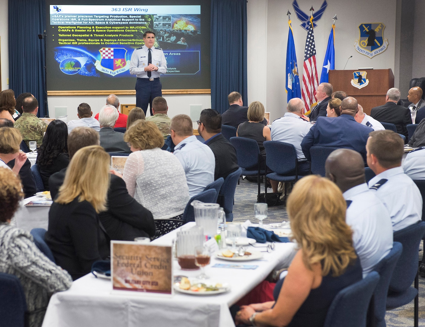 Maj. Gen Bradford “BJ” Shwedo, Commander of the 25th Air Force, JBSA-Lackland, San Antonio, Texas, briefs members of the San Antonio Chamber of Commerce on the world wide mission of the unit in the headquarters auditorium Friday.