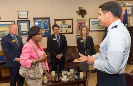 San Antonio Mayor Ivy Taylor is presented a Commander’s Coin from 25th Air Force Commander Bradford “BJ” Shwedo during her visit Friday with the San Antonio Chamber of Commerce to the 25th Air Force headquarters. Looking on are three members of the San Antonio Chamber, Dave Petersen, left, Executive Vice President of the Chamber, Richard Perez, center, Chamber President and Renee Flores, right, Chairman of the Board. The three Chamber executives were also ‘coined’ by Shwedo.