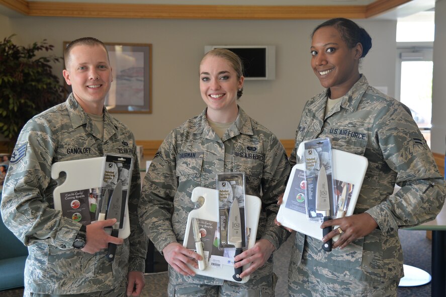 Staff Sgt. Christopher Gangloff, left,  Airmen 1st Class Natalie Thurman, center, and Solana McMillan, the winners of the fourth quarter 1805Warrior Chef competition, pose for a photo Aug. 3, 2016, at Malmstrom Air Force Base, Mont. The team will travel to Barksdale Air Force Base, La., to compete in the Global Strike Warrior Chef Competition. (U.S. Air Force photo/Airman 1st Class Daniel Brosam)