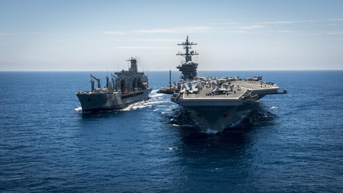 The aircraft carrier USS Carl Vinson (CVN 70) conducts a replenishment-at-sea with fleet replenishment oiler USNS Yukon (T-AO 202). Carl Vinson is underway with embarked Carrier Air Wing 2 and Destroyer Squadron 1 conducting the Tailored Ship's Training Availability (TSTA) and Final Evaluation Problem in preparation for their upcoming deployment. During TSTA, Afloat Training Group Pacific evaluates training drills and real-world scenarios, while placing an emphasis on damage control, flight deck operations and simulated combat.