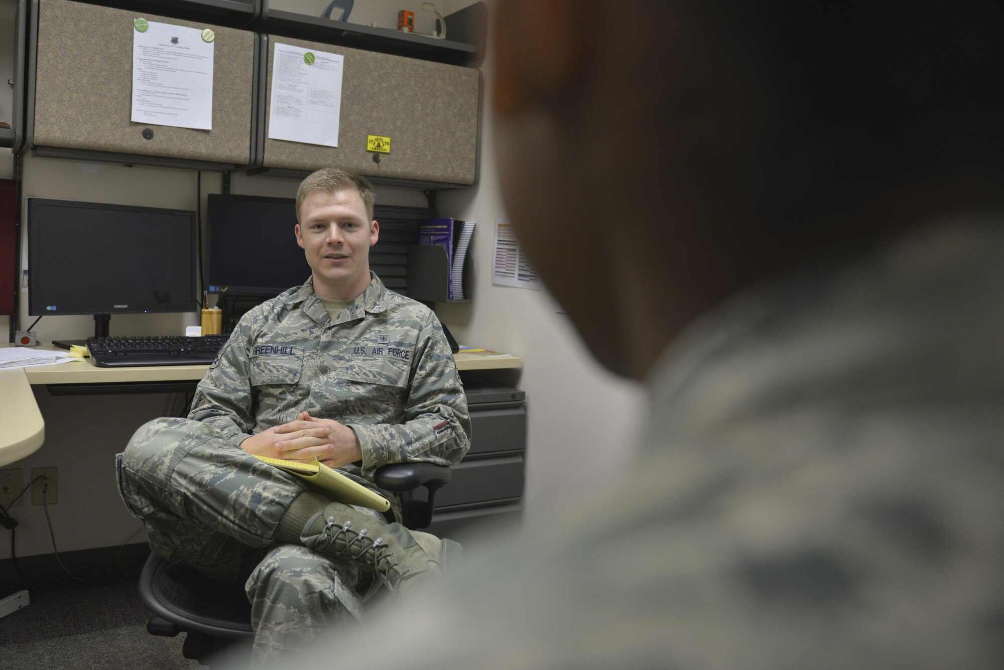 U.S. Air Force Airman 1st Class Terence Greenhill, a 354th Medical Group mental health technician, talks with a patient Aug. 3, 2016, at Eielson Air Force Base, Alaska. Greenhill helps to counsel patients during appointments. (U.S. Air Force photo by Airman Isaac Johnson)