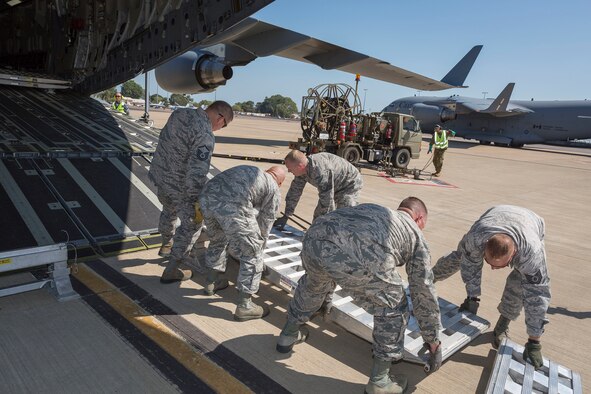 U.S. Airmen prepare a ramp extension on a Royal Australian Air Force (RAAF) C-17A Globemaster during exercise PITCH BLACK 16 (PB16) at RAAF Base Darwin, Australia, Aug. 2, 2016. PB16 allows participant nations to exercise deployed units in the tasking, planning and execution of Offensive Counter Air and Offensive Air Support while utilizing one of the largest training airspace areas in the world.  The exercise is scheduled from July 29 to Aug.19, 2016. (Australian Defence Force photo by Cpl. David Gibbs)