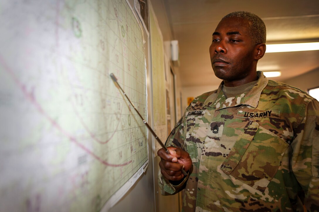 U.S. Army Sgt. 1st Class Jermaine R. Ellington, assigned to the 5th Battlefield Coordination Detachment, gives a mission brief during Exercise Pitch Black 2016. Pitch Black is a biennial multinational air warfare exercise hosted by the Royal Australian Air Force (RAAF) that focuses on offensive counter air and defensive counter air combat in a simulated war environment. (Australian Defence Force photo by Cpl. Casey Gaul)