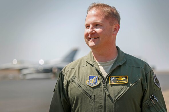 U.S. Air Force Lt. Col. Mark Heusinkveld, 14th Expeditionary Fighter Squadron commander, assigned to Misawa Air Base, Japan, stops for a photo during exercise PITCH BLACK 16 (PB16), at RAAF Darwin, Australia, Aug. 2, 2016. PB16 allows participant nations to exercise deployed units in the tasking, planning and execution of Offensive Counter Air and Offensive Air Support while utilizing one of the largest training airspace areas in the world.  The exercise is scheduled from July 29 to Aug.19, 2016. (Australian Defence Force photo by Cpl. Casey Gaul)