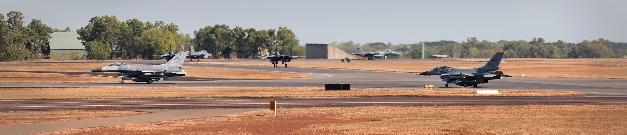 A U.S. Air Force F-16C aircraft and Republic of Singapore Air Force F-15 Eagle aircraft taxi during exercise PITCH BLACK 16 (PB16) at Royal Australian Air Force (RAAF) Base Darwin, Australia, Aug. 1, 2016. PB16 allows participant nations to exercise deployed units in the tasking, planning and execution of Offensive Counter Air and Offensive Air Support while utilizing one of the largest training airspace areas in the world.  The exercise is scheduled from July 29 to Aug.19, 2016. (Australian Defence Force photo by Cpl. Casey Gaul)