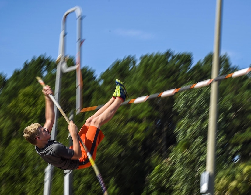 Andrew Bronson, 14, son of 628th Air Base Wing Command Chief Master Sgt. Mark A. Bronson, launches himself into the air during pole vaulting practice at the Park West Recreation Center in Mt. Pleasant, S.C., July 20, 2016. Bronson was preparing to compete in the USA Track and Field National Junior Olympics which took place in Sacramento, Calif., July 25-31, 2016. (U.S. Air Force photo by Staff Sgt. Marianique Santos/Released)