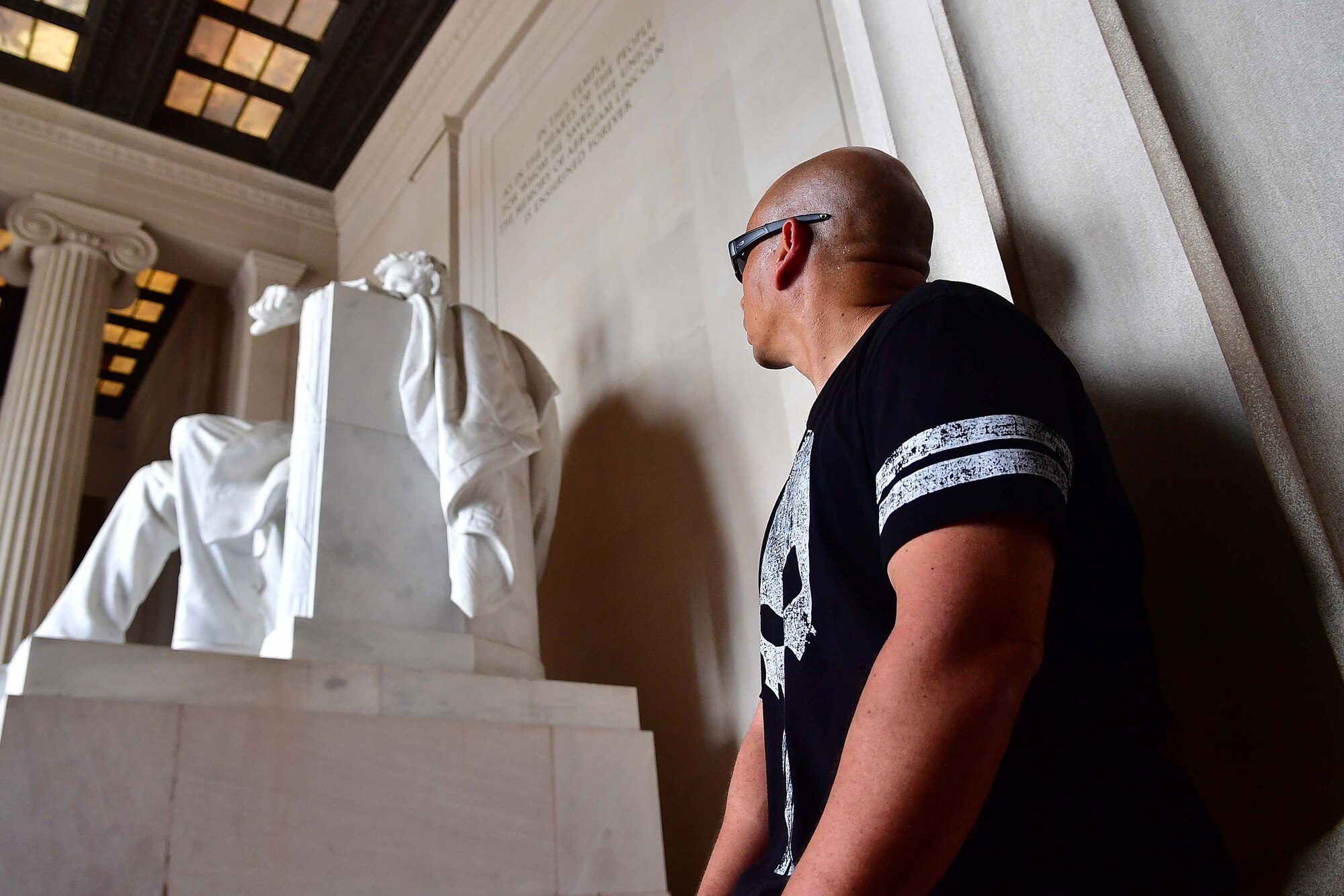 Senior Master Sgt. Jack Minaya, the Air National Guard's Outstanding First Sergeant of the Year, pauses for reflection at the Lincoln Memorial during a tour of monuments on the national mall in Washington, D.C., August 3, 2016. The tour was part of the ANG's Focus on the Force Week, a series of events highlighting the importance of professional development for Airmen at all levels, and the recognition of accomplishments throughout the enlisted corps. (U.S. Air National Guard photo by Staff Sgt. John Michaels)