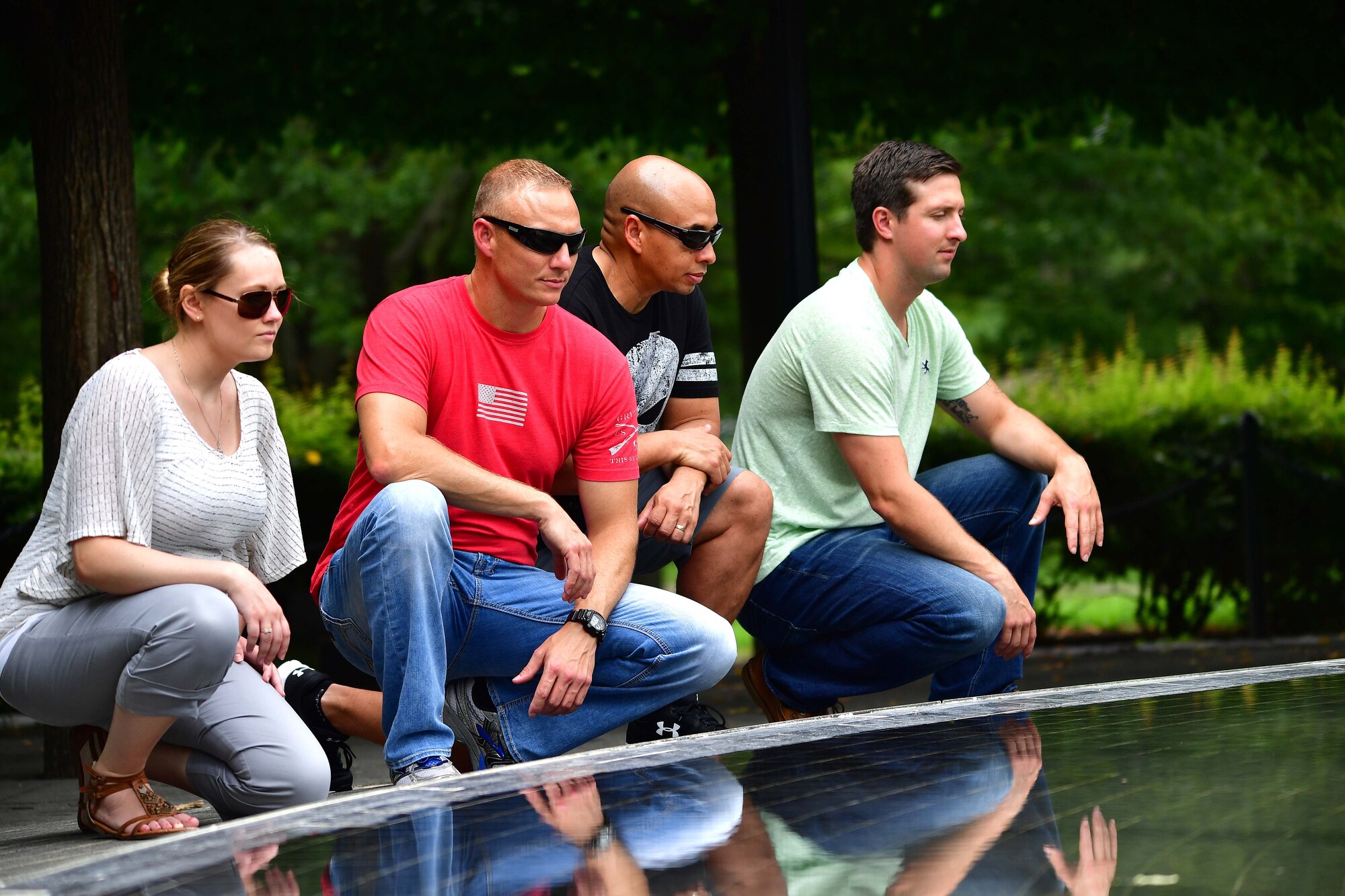 The Air National Guard's 2016 Outstanding Airmen of the Year kneel by a fountain at the Korean War Memorial on the national mall in Washington, D.C., August 3, 2016. The tour was part of the ANG's Focus on the Force Week, a series of events highlighting the importance of professional development for Airmen at all levels, and the recognition of accomplishments throughout the enlisted corps. The OAY Airmen are (from left): Staff Sgt. Jennifer Masters, Outstanding Airman of the Year, 178th Wing, Ohio ANG; Senior Master Sgt. Mark Farmer, Outstanding Senior Non-commissioned Officer of the Year, 125th Fighter Wing, Florida ANG; Senior Master Sgt. Jack Minaya, Outstanding First Sergeant of the Year, Arizona ANG; Tech. Sgt. Nicholas Jewell, Outstanding Non-commissioned Officer of the Year, Kentucky ANG. (U.S. Air National Guard photo by Staff Sgt. John Michaels)