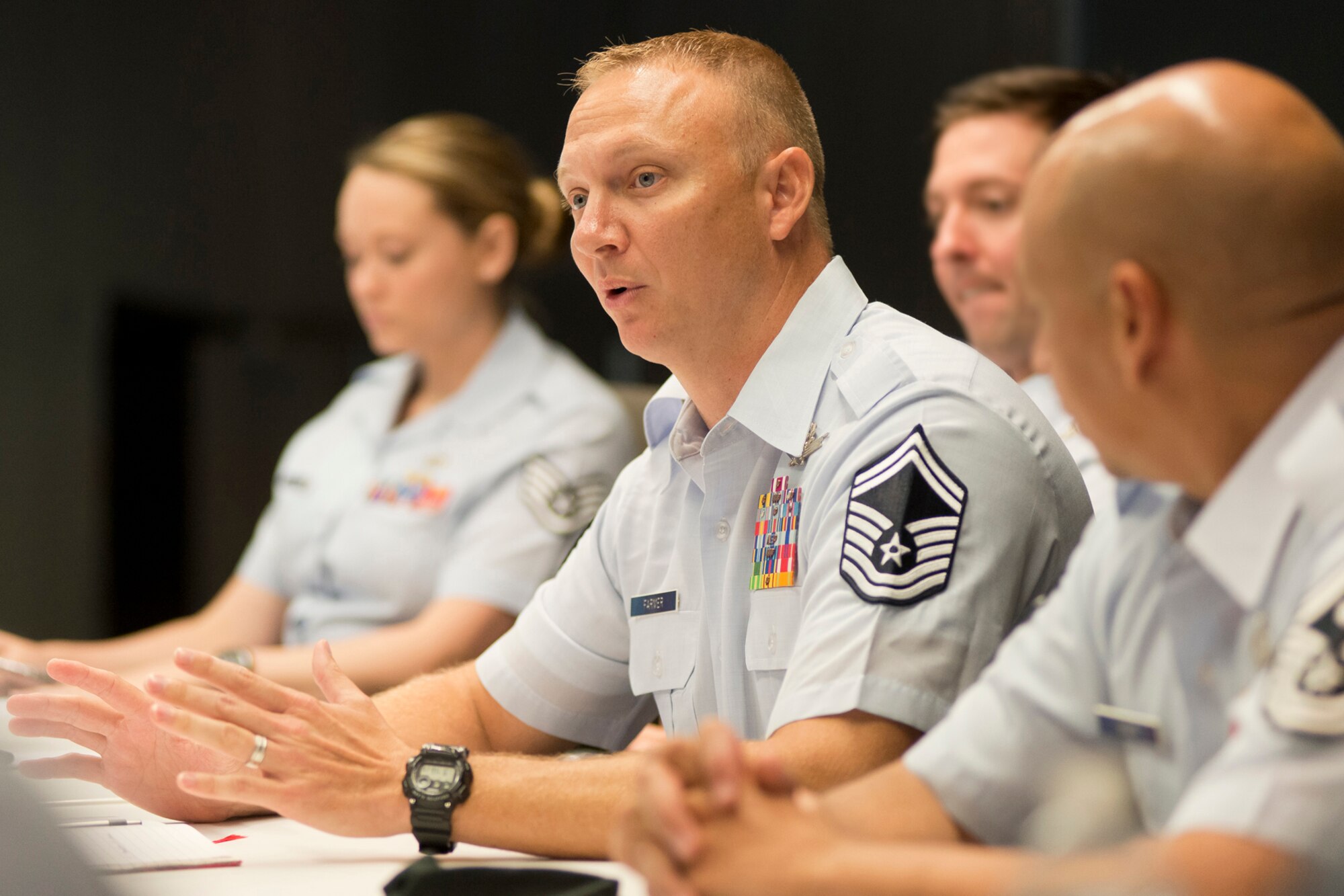 Senior Master Sgt. Mark E. Farmer, space systems operations superintendent with the 114th Space Control Squadron, Florida Air National Guard and the ANG Outstanding Senior Non-Commissioned Officer of the Year, responds to a question during the Focus on the Force Week's Enlisted Field Advisory Council meeting. Focus on the Force Week is a series of events highlighting the importance of professional development for Airmen at all levels, and the recognition of accomplishments throughout the enlisted corps. The other OAY winners are Staff Sgt. Jennifer D. Masters, Airman of the Year; Tech. Sgt. Nicholas Jewell, Non-Commissioned Officer of the Year; and Senior Master Sgt. Jack Minaya, First Sergeant of the Year. Focus on the Force Week is a series of events highlighting the importance of professional development for Airmen at all levels, and the recognition of accomplishments throughout the enlisted corps. The OAY Airmen bring the perspective of the 91,000 enlisted Airmen across the ANG to address challenges facing the enlisted force. (U.S. Air National Guard photo by Master Sgt. Marvin R. Preston)