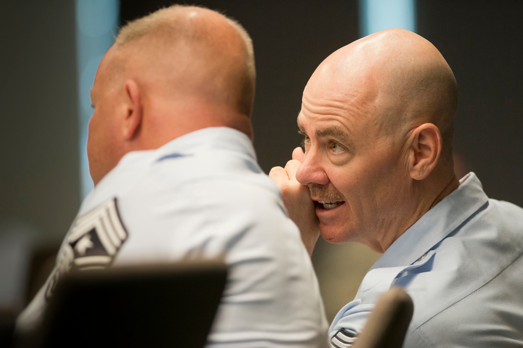 Chief Master Sgt. Ronald C. Anderson, the 12th command chief master sergeant of the Air National Guard, exchanges comments with Chief Master Sgt. James L. Brown, command senior enlisted leader for the Kansas National Guard and Enlisted Field Advisory Council president, during Focus on the Force Week's EFAC meeting. Focus on the Force Week is a series of events highlighting the importance of professional development for Airmen at all levels, and the recognition of accomplishments throughout the enlisted corps. (U.S. Air National Guard photo by Master Sgt. Marvin R. Preston)