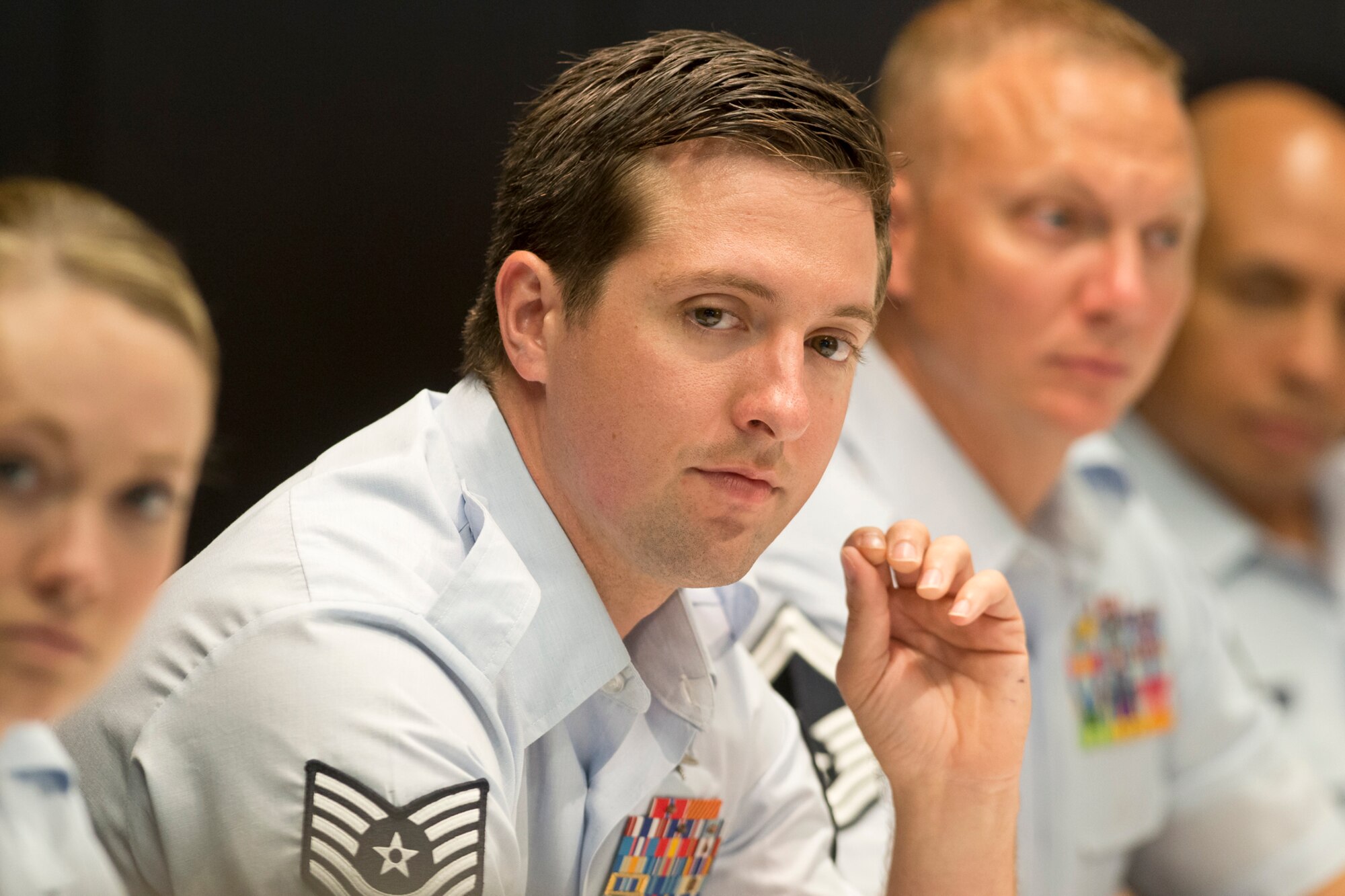 Tech. Sgt. Nicholas Jewell, a combat controller from the 123rd Special Tactics Squadron, Kentucky Air National Guard and the ANG Non-Commissioned Officer of the Year listens to a question during the Focus on the Force Week's Enlisted Field Advisory Council meeting. Focus on the Force Week is a series of events highlighting the importance of professional development for Airmen at all levels, and the recognition of accomplishments throughout the enlisted corps. The OAY winners are Staff Sgt. Jennifer Masters, Airman of the Year; Senior Master Sgt. Mark Farmer, Senior Non-Commissioned Officer of the Year; and Senior Master Sgt. Jack Minaya, First Sergeant of the Year. The OAY Airmen bring the perspective of the 91,000 enlisted Airmen across the ANG to address challenges facing the enlisted force. (U.S. Air National Guard photo by Master Sgt. Marvin R. Preston)