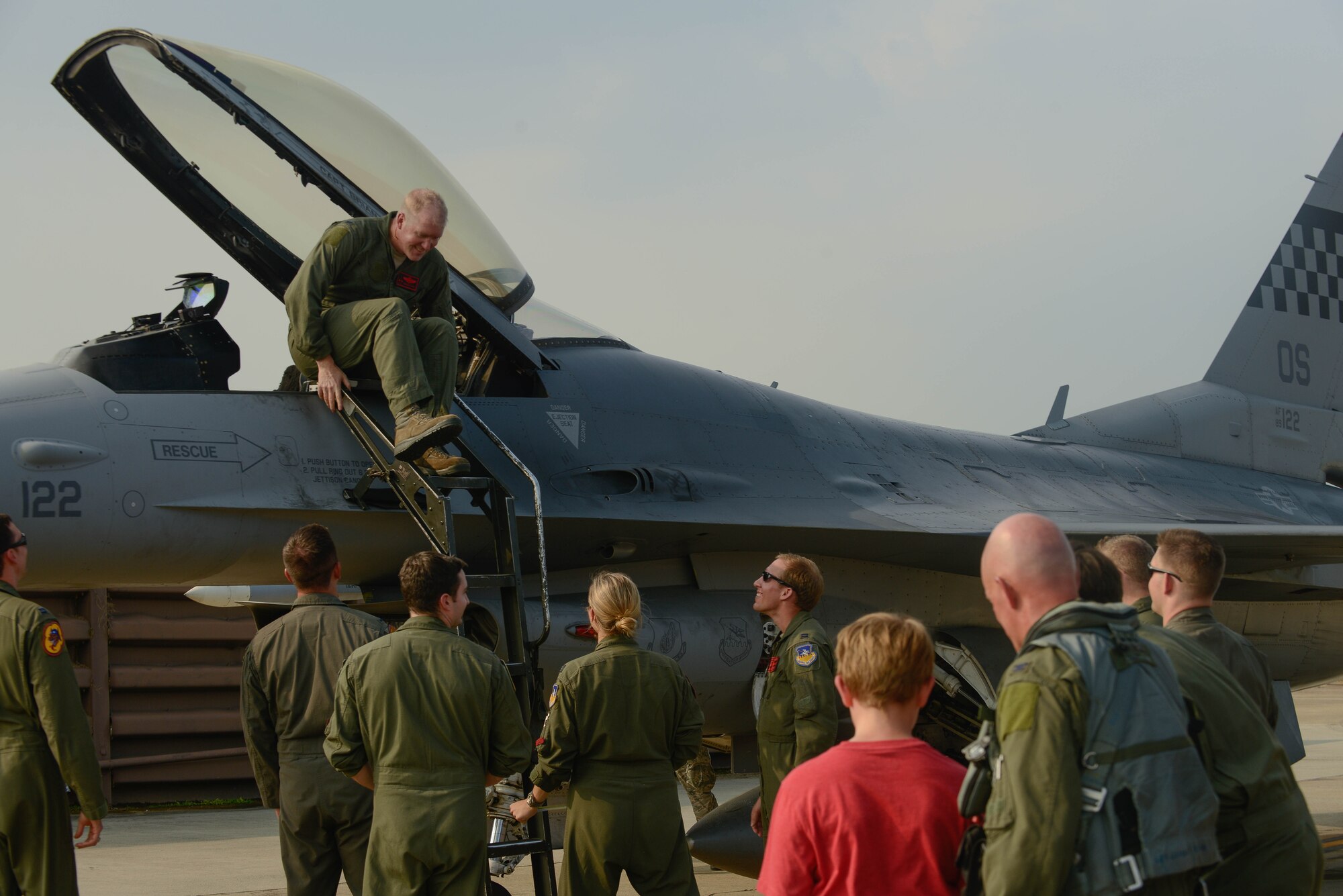 Col. Brian Carr, 51st Fighter Wing vice commander, exits an F-16 Fighting Falcon following his final flight at Osan Air Base, Republic of Korea, Aug. 4, 2016. Carr will be retiring after more than 23 years of service to the Air Force, with three years spent assisting in the defense of the Korean Peninsula. (U.S. Air Force photo by Senior Airman Dillian Bamman)