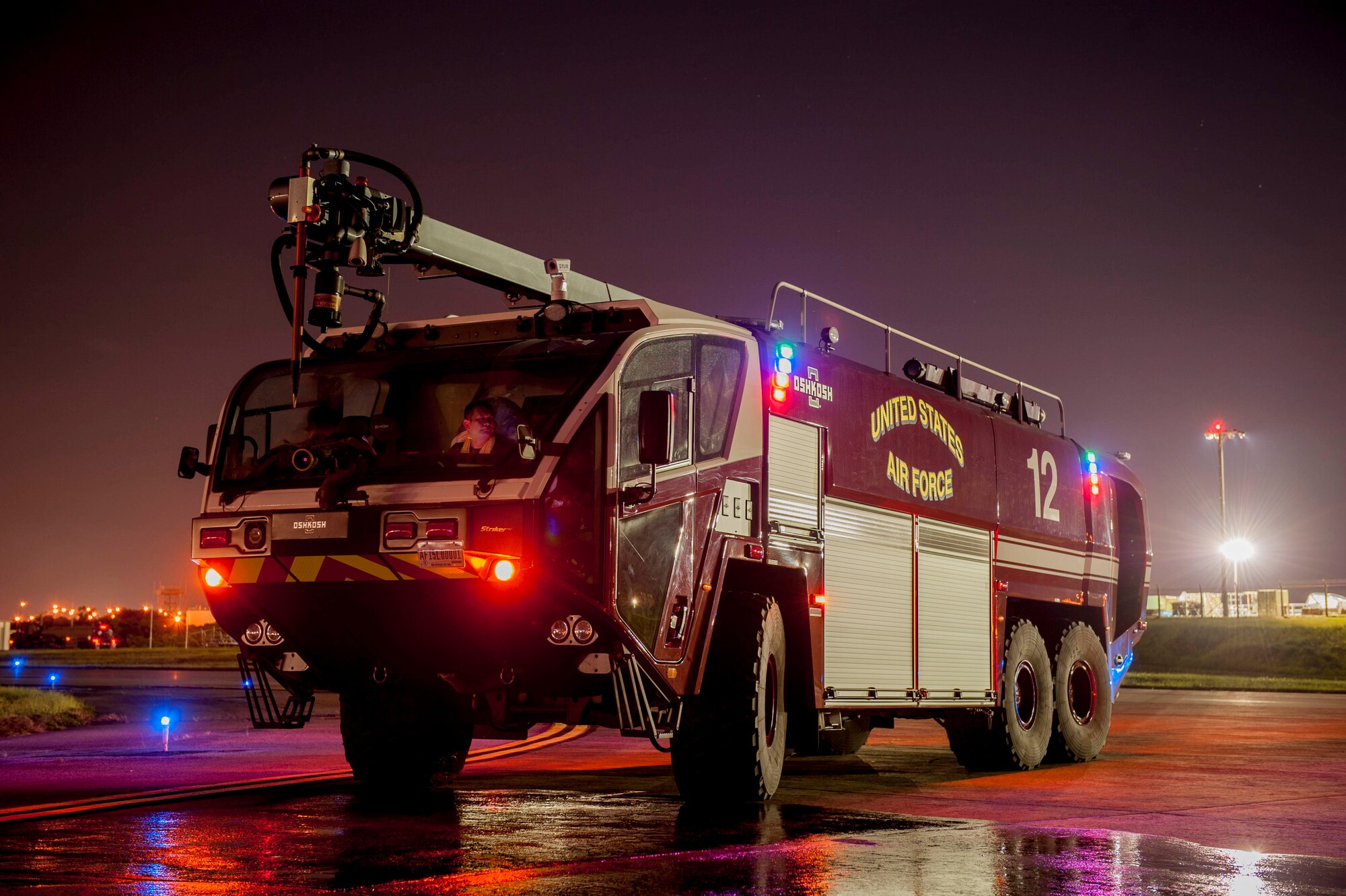 An 18th Civil Engineer Squadron Oshkosh Striker fire truck stands ready during a hot refueling exercise July 27, 2016, at Kadena Air Force Base, Japan. With a top speed of 70-mph and an engine capable of 1,950 foot-pounds of torque at 1,400 rpm, fire suppression teams can respond immediately to emergencies anywhere on the flight line. (U.S. Air Force photo by Senior Airman Peter Reft)