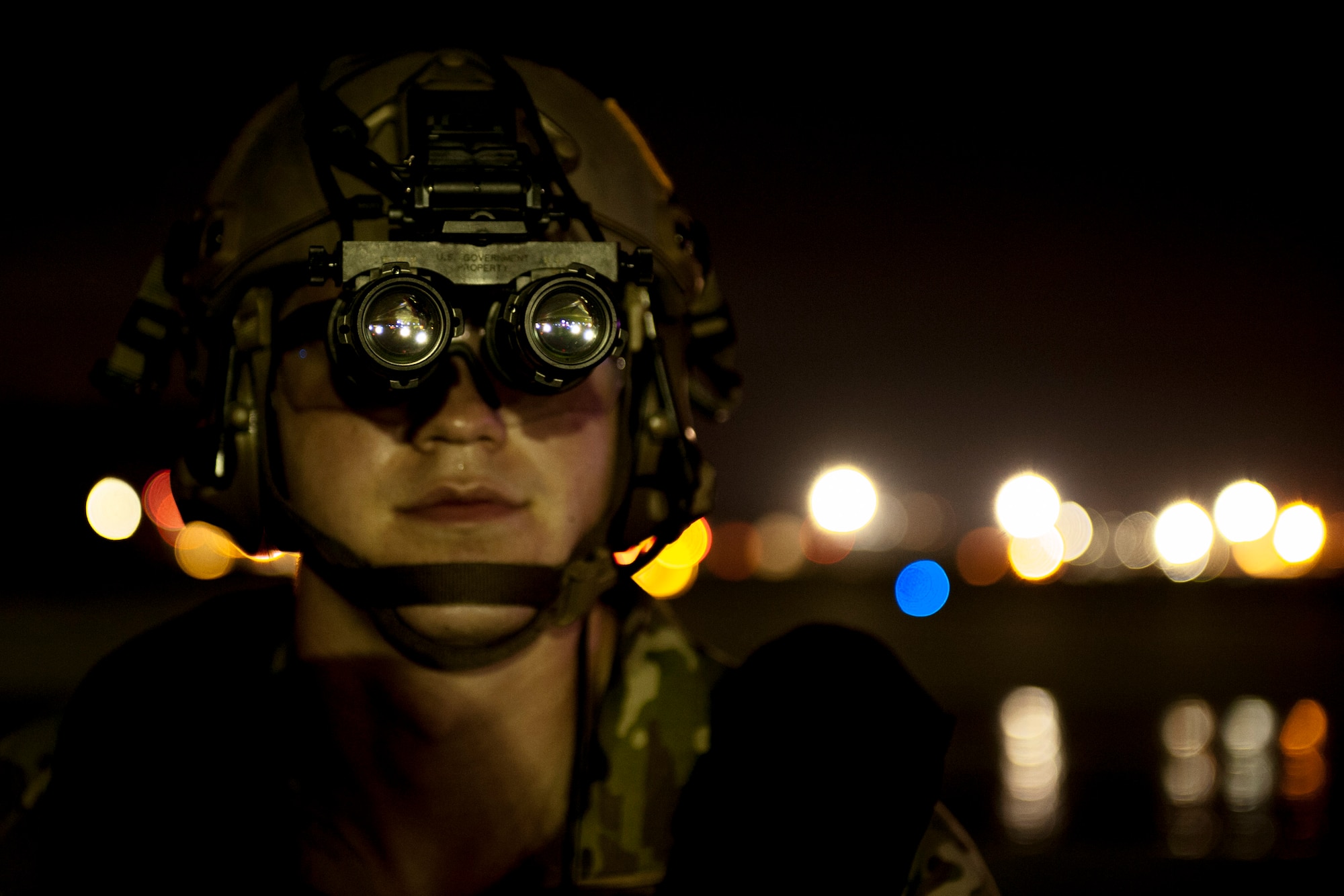 Senior Airman Brandon Craver, 18th Logistics Readiness Squadron fuels distribution operator, observes the flight line during a nighttime refueling exercise July 27, 2016, at Kadena Air Base, Japan. The 18th LRS and 1st Special Operations Squadron conducted a refueling exercise to demonstrate forward-area refueling point capability in an austere environment. (U.S. Air Force photo by Senior Airman Peter Reft)