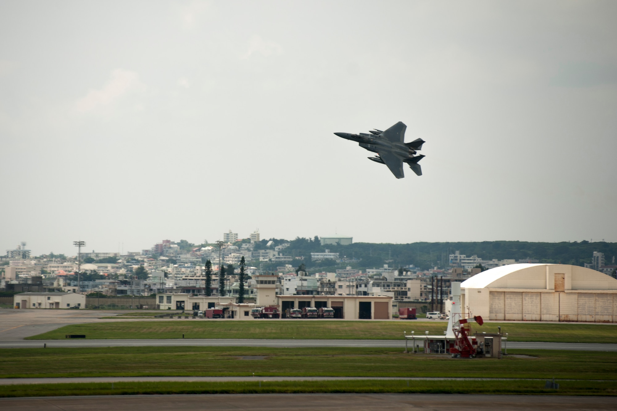 An F-15 Eagle assigned to the 44th Fighter Squadron performs a flyby over the flight line July 28, 2016, at Kadena Air Base, Japan. The 18th Wing hosts a fleet of 81 combat-ready aircraft and remains at constant readiness to respond at a moment’s notice to crisis and conflict anywhere in the Indo-Asia Pacific region. (U.S. Air Force photo by Senior Airman Peter Reft)