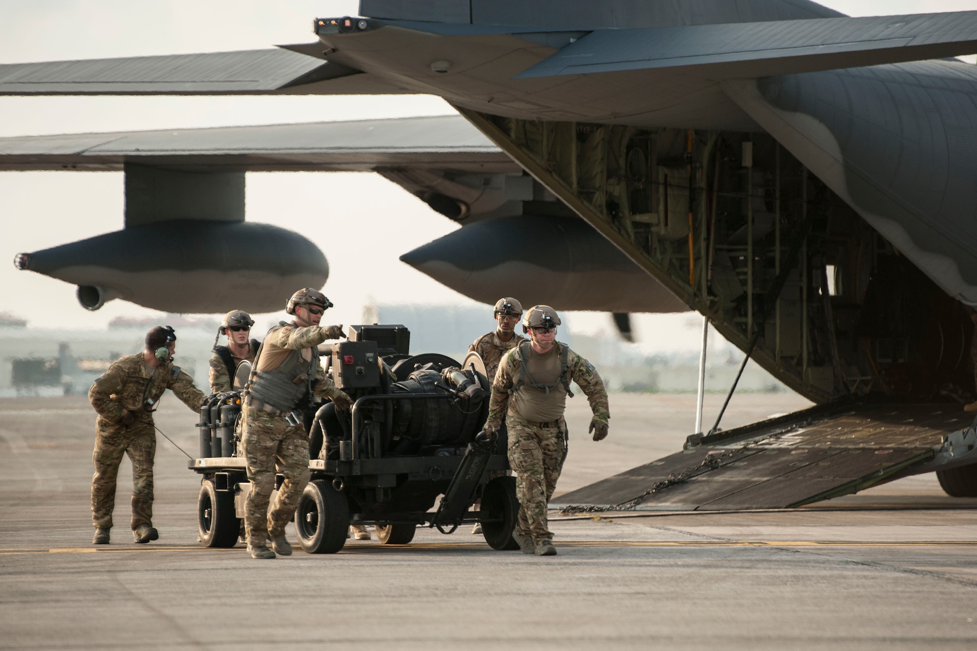 Airmen from the 18th Logistics Readiness Squadron forward area refueling point team and 1st Special Operations Squadron unload a forward area manifold cart from an MC-130H Combat Talon II July 28, 2016, at Kadena Air Base, Japan. The 18th LRS conducted a hot refueling exercise on the flight line to demonstrate forward operations capability. (U.S. Air Force photo by Senior Airman Peter Reft)
