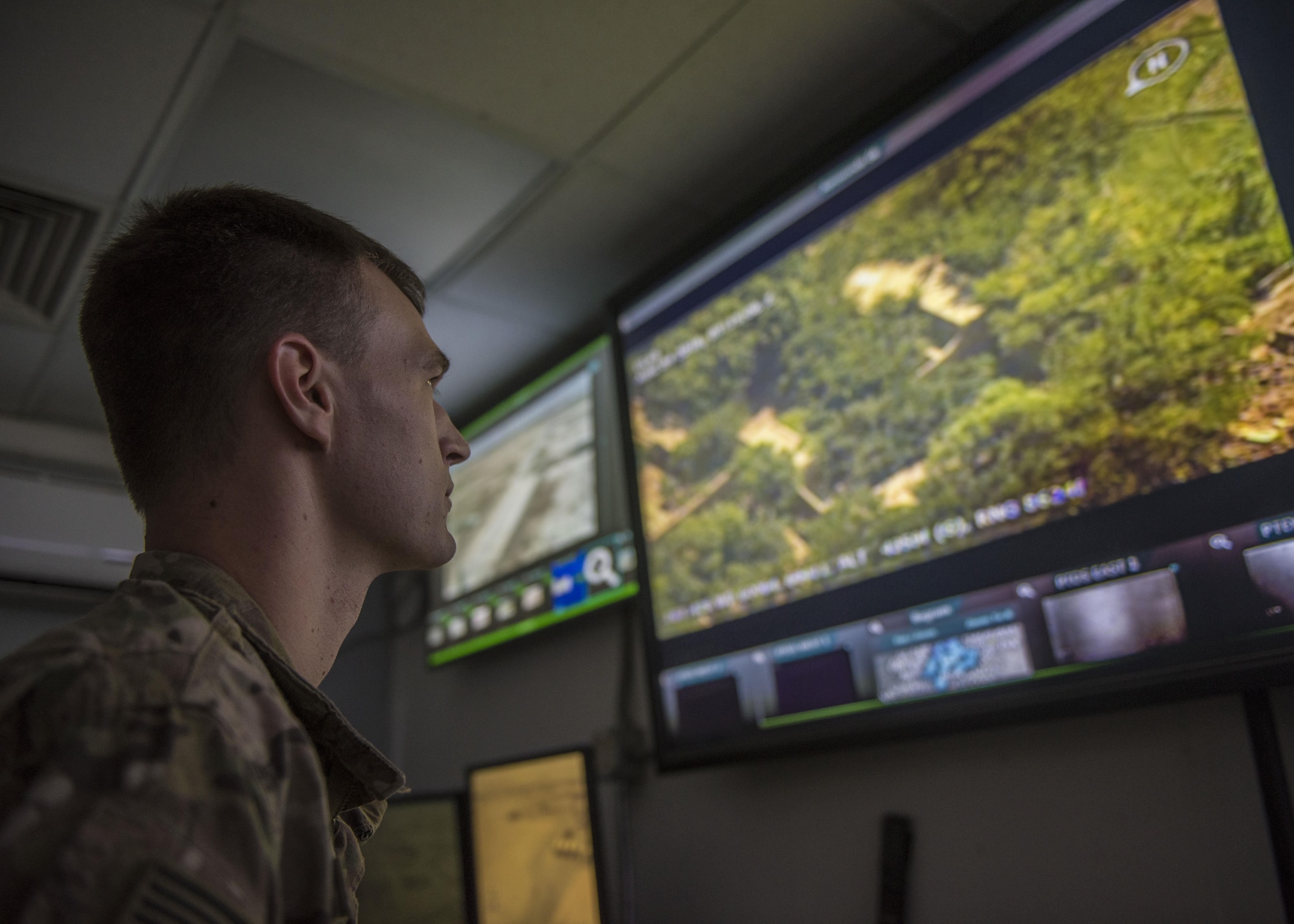 Staff Sgt. Dakota Karlsen, 455th Expeditionary Security Forces Squadron, echo sector controller, keeps watch of the base, Bagram Airfield, Afghanistan, Aug. 4, 2016. Having situational awareness of not only the echo sector, but the entire base, help the controllers to coordinate with other command post controllers around the base in the event of an emergency. (U.S. Air Force photo by Senior Airman Justyn M. Freeman)