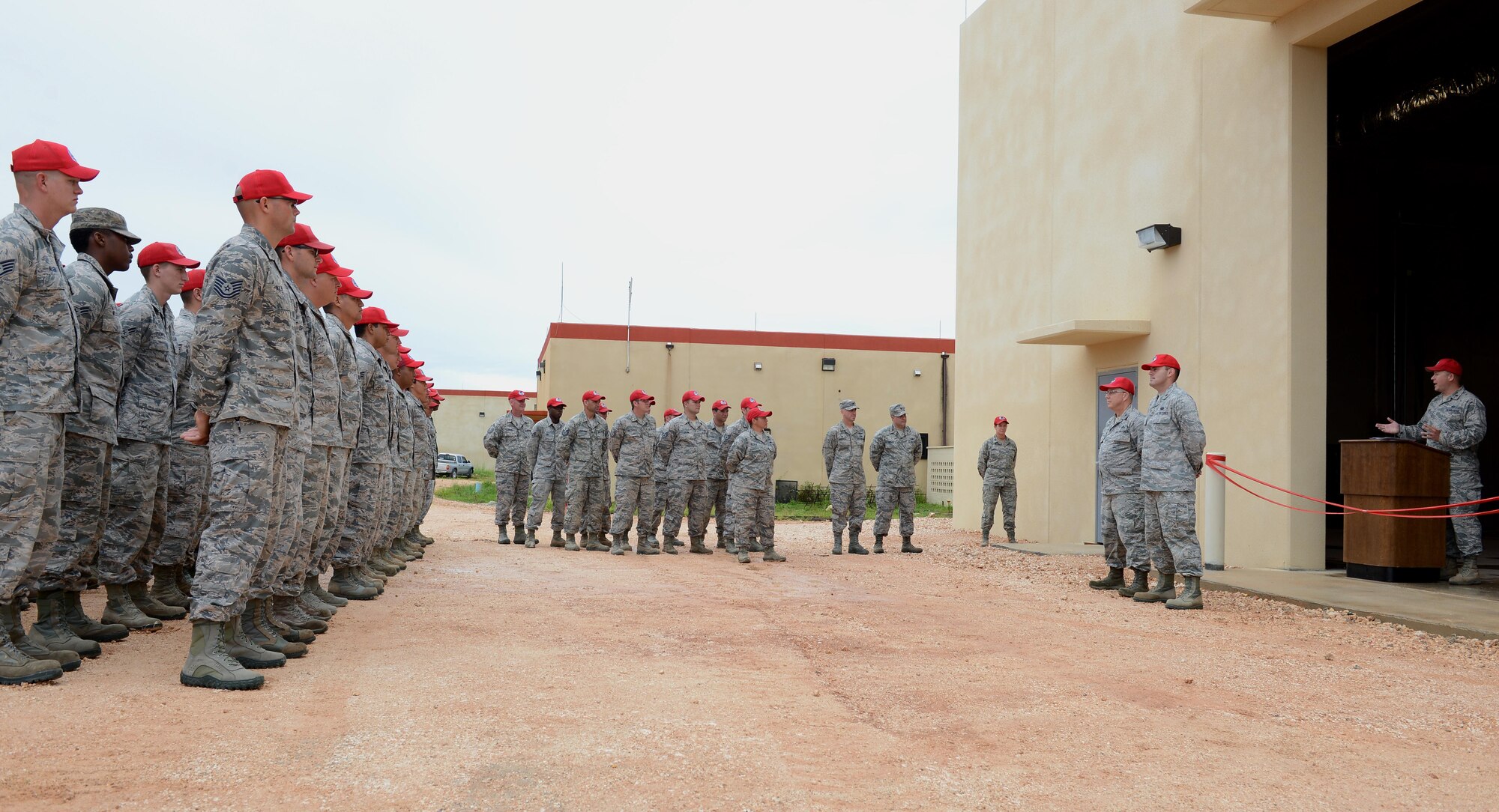 Airmen with the 556th, 554th and 254th RED HORSE Squadrons attend a ribbon cutting ceremony July 26, 2016, at Andersen Air Force Base, Guam. The five-month long project brought together Reservists from four RHS units consisting of nine rotations for hands-on training with the 556th RHS as the lead unit for the duration of the project.  (U.S. Air Force photo/Airman 1st Class Arielle Vasquez)