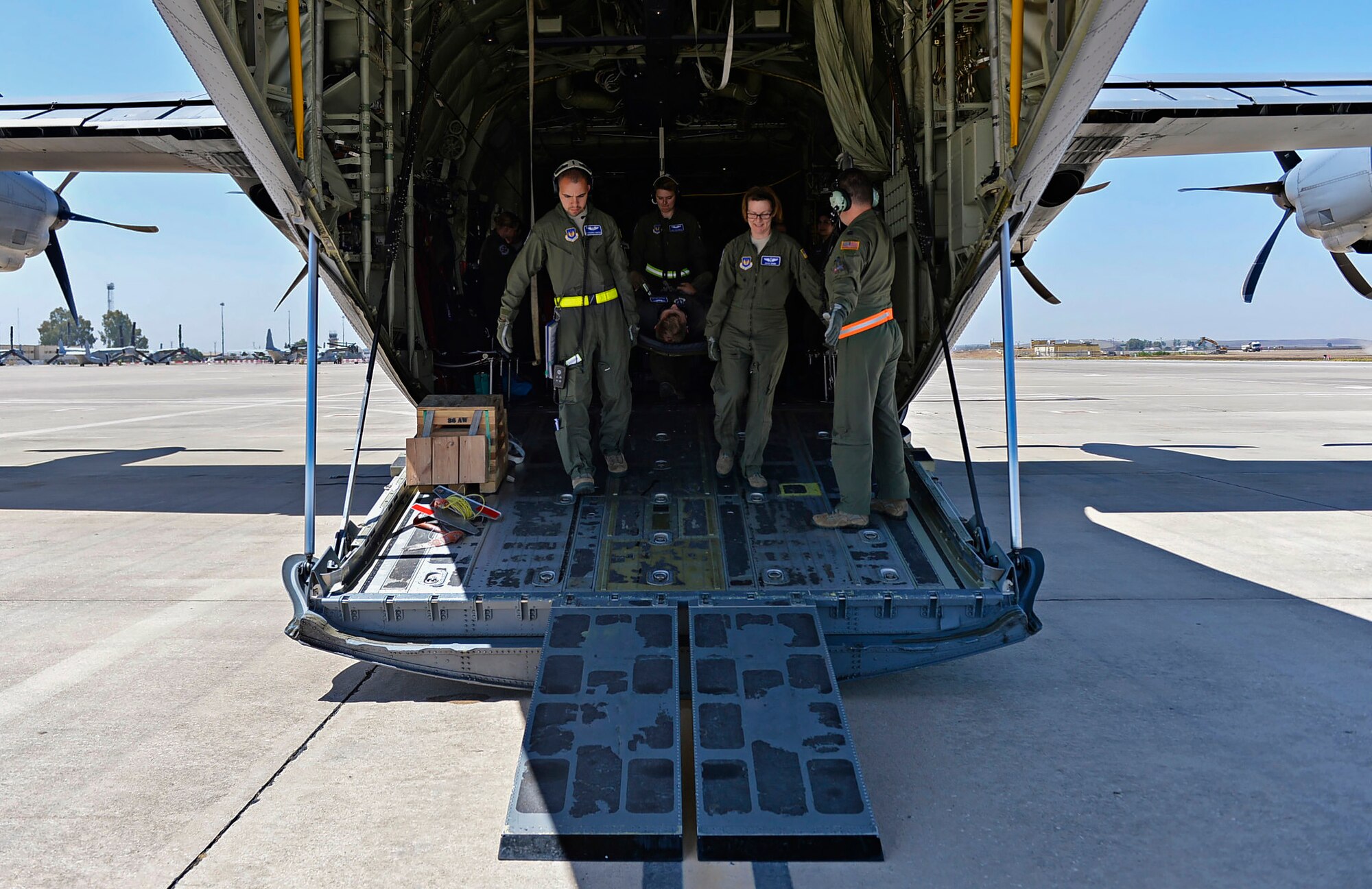 Airmen from the 86th Aeromedical Evacuation Squadron carry a simulated patient during a training mission at Ramstein Air Base, Germany, July 21, 2016. Their patients include veterans and their dependents injured across Europe, Africa and in deployed locations. (U.S. Air Force photo/ Senior Airman Nesha Humes)