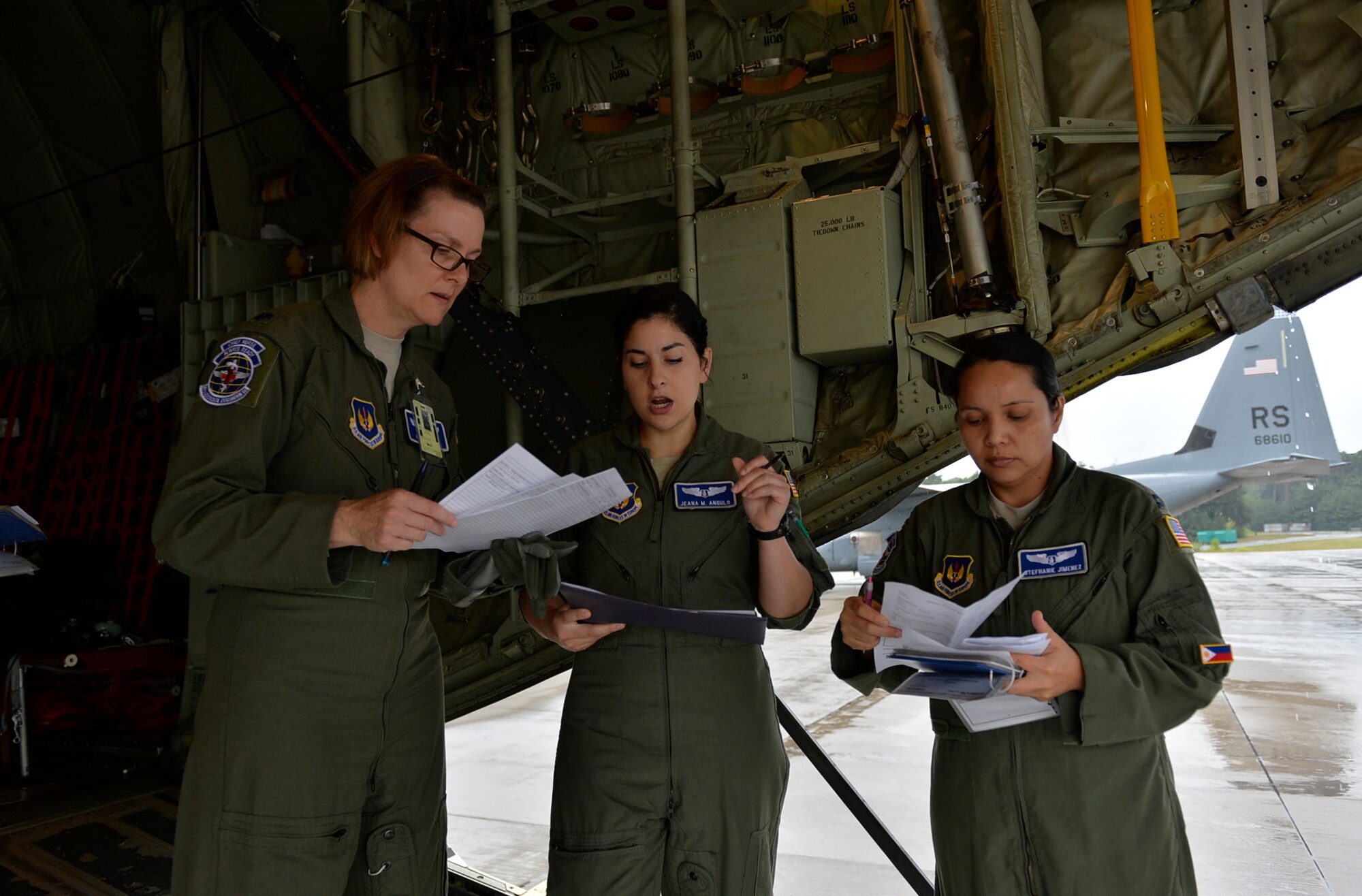 Nurses from the 86th Aeromedical Evacuation Squadron, discuss mission plans during a training mission at Ramstein Air Base, Germany, July 21, 2016. The Airmen conduct ARMs in order to provide time-sensitive, mission-critical en route care to patients being transported to medical treatment facilities. (U.S. Air Force photo/ Senior Airman Nesha Humes)