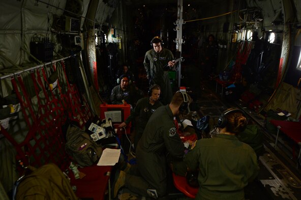 Airmen from the 86th Aeromedical Evacuation Squadron  assess a mock patient during a training mission at Ramstein Air Base, Germany, July 21, 2016. There are currently four U.S. Air Force active-duty AESs, which make up 29 percent of the total aeromedical evacuation capability. (U.S. Air Force photo/ Senior Airman Nesha Humes)