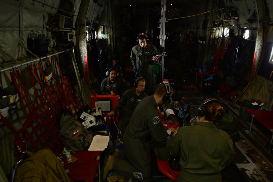 Airmen from the 86th Aeromedical Evacuation Squadron  assess a mock patient during a training mission at Ramstein Air Base, Germany, July 21, 2016. There are currently four U.S. Air Force active-duty AESs, which make up 29 percent of the total aeromedical evacuation capability. (U.S. Air Force photo/ Senior Airman Nesha Humes)