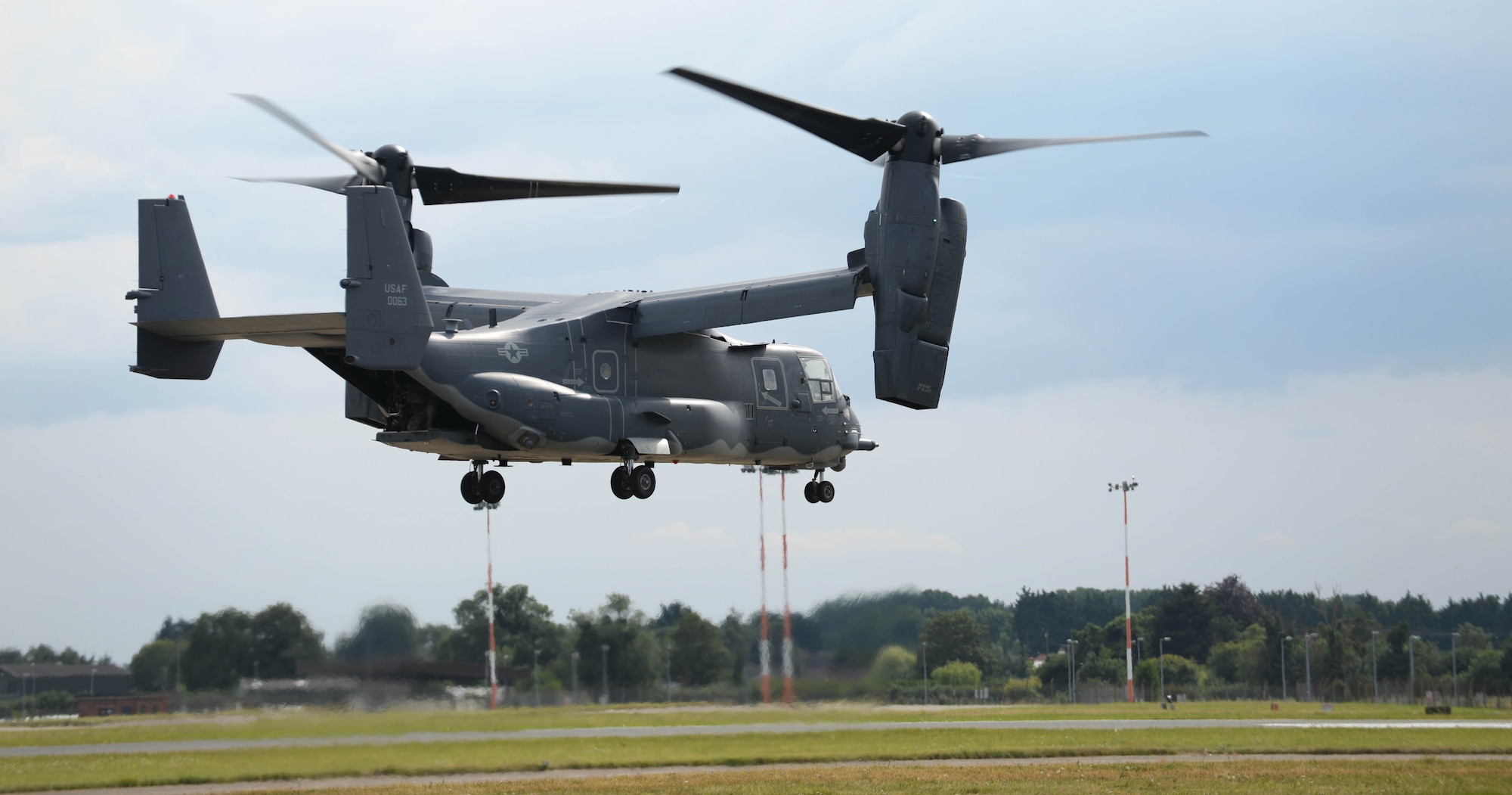 A U.S. Air Force CV-22 Osprey takes off Aug. 1, 2016, from RAF Mildenhall, England. The 352nd Special Operations Wing ended the tour for U.S. Army Maj. Gen. Mark C. Schwartz, commander of the Special Operations Command-Europe, with a flight. (U.S. Air Force photo by Airman 1st Class Tenley Long)