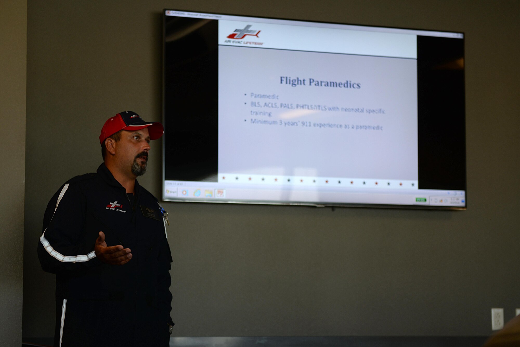 Chris Whitmus, an Air Evac Lifeteam 34 pilot, gives a medical air evacuation training session at Sheppard Air Force Base, Texas, Aug. 3, 2016. Airmen from both the 82nd Civil Engineer Squadron fire department and 82nd Medical Group participated in the training to increase interoperability and familiarization with air evacuation procedures. (U.S. Air Force photo by Senior Airman Kyle E. Gese/Released)
