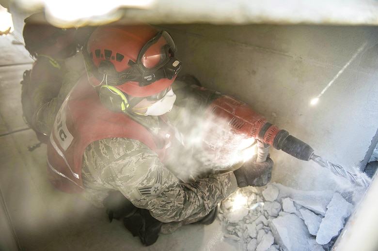 Multiple units from the Army and Air National Guard work their way through rubble to rescue victims during Vigilant Guard 2016 at Camp Johnson in Colchester, Vt., July 30, 2016. Vigilant Guard is a national-level emergency response exercise which provides National Guard units an opportunity to improve cooperation and relationships with regional civilian, military and federal partners in preparation for emergencies and catastrophic events. (U.S. Air National Guard photo/Senior Airman Jonathon Alderman)