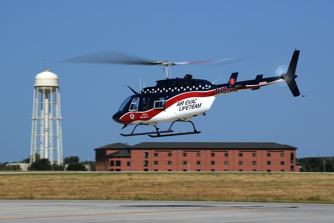 The Air Evac Lifeteam 34 team departs from Sheppard Air Force Base, Texas, Aug. 3, 2016, after a familiarization tour and air evacuation-training session. Airmen from both the 82nd Civil Engineer Squadron fire department and 82nd Medical Group listen to Chris Whitmus, an Air Evac Lifeteam 34 pilot as he trains them in preparation for Sheppard’s 75th anniversary air show celebration. (U.S. Air Force photo by Senior Airman Kyle E. Gese/Released)