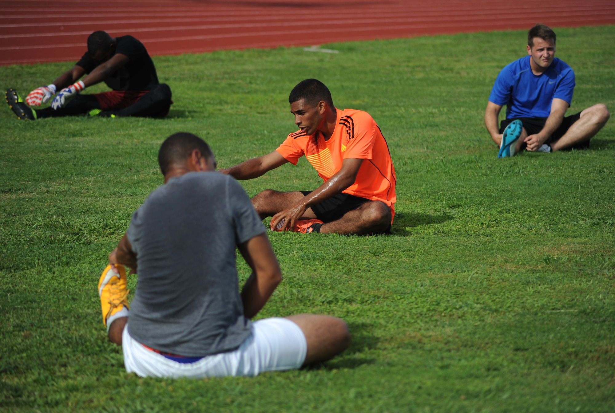 Members of MacDill Football Club stretch before training drills during a team practice at MacDill Air Force Base, Fla., August 3, 2016. The team is preparing to compete in the Defender’s Cup, a national military tournament hosted at Lackland AFB, Texas September 2, 2016. (U.S. Air Force photo by Airman Adam R. Shanks)
