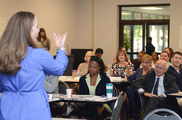 Laura Chiang, from the Center for Disease Control and Prevention, interacts with a group of participants during a discussion on barriers to effective prevention at the Primary Prevention of Violence Foundation training seminar at Dobbins Air Reserve Base, Ga., July 19, 2016. The 10-day training program took place from July 18-29 and involved guest speakers from Headquarters Air Force, the CDC and Green Dot Etc. (U.S. Air Force photo/Don Peek)