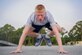 Junior Reserve Officers' Training Corps cadet Derrick Drennen performs a burpee during physical training at Hurlburt Field, Fla., July 20, 2016. From July 18-22, more than 60 Junior ROTC cadets from nearby high schools visited base for their Summer Leadership School - a course designed to teach cadets leadership, confidence and other traits. (U.S. Air Force photo by Airman 1st Class Joseph Pick)