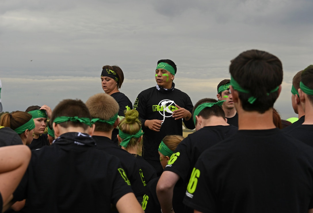 Leaders of the green team prepare their group for the beginning of ‘The RACE’ at Royal Air Force Lakenheath, England, Aug. 1, 2016. ’The RACE’ is a chapel-led program that helps create positive relationships between students of all ages. (U.S. Air Force photo by Airman 1st Class Abby L. Finkel)
