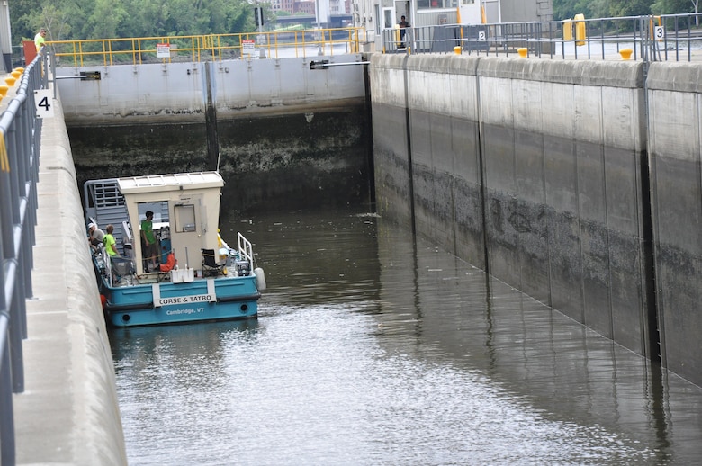 A vessel traveling through the Troy Lock and Dam.  