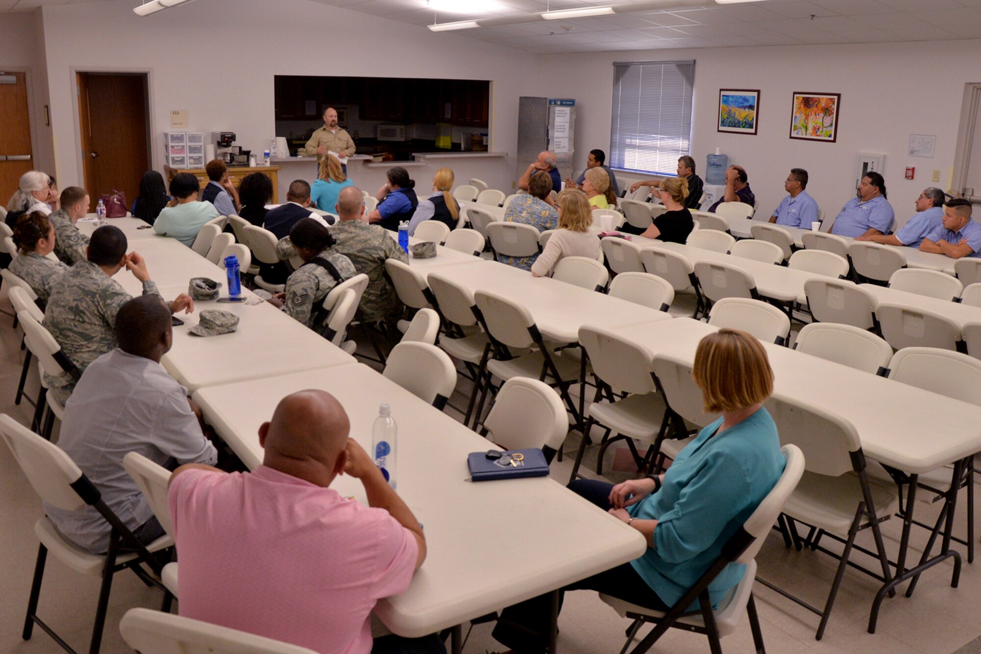 Goodfellow members listen as Mike Gainey, 17th Civil Engineer Squadron electrics supervisor, teaches a class on dealing with difficult customers at the Taylor Chapel on Goodfellow Air Force Base, Texas, Aug. 4, 2016. Gainey recommends to never argue with customers when they are angry, displeased or complaining. (U.S. Air Force photo by Airman 1st Class Randall Moose/Released)