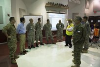 Eduardo Olivarez, Chief Administative Officer, Hidalgo County Department of Human Health Services (DHHS) and Texas State Guard leadership show leaders in the Chilean military the operations center at an Operation Lone Star (OLS) site in Pharr, Texas, July 27, 2016. The Texas Military Department, as a part of the State Partnership Program (SPP), partners with the Chilean military and conducts numerous exchanges each year facilitating cooperation across all aspects of international civil-military affairs and encouraging people-to-people ties at the state level. OLS is an annual medical disaster preparedness training exercise, uniting federal, state and local health and human service providers, that addresses the medical needs of thousands of underserved Texas residents every year. (U.S. Army National Guard photo by Sgt. 1st Class Malcolm McClendon)