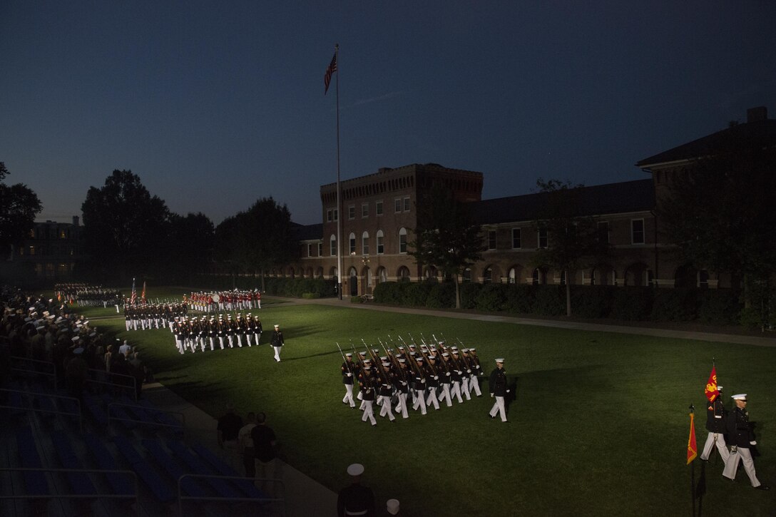 Marines of Marine Barracks Washington, D.C., perform pass in review during a retirement ceremony in honor of Gen. John M. Paxton Jr., outgoing assistant commandant of the Marine Corps, at Marine Barracks Washington, D.C., Aug. 4, 2016. Paxton, the only assistant commandant to serve three commandants and oldest active duty Marine, served 42 selfless and dedicated years in the Marine Corps. (Official Marine Corps photo by Cpl. Chi Nguyen/Released)