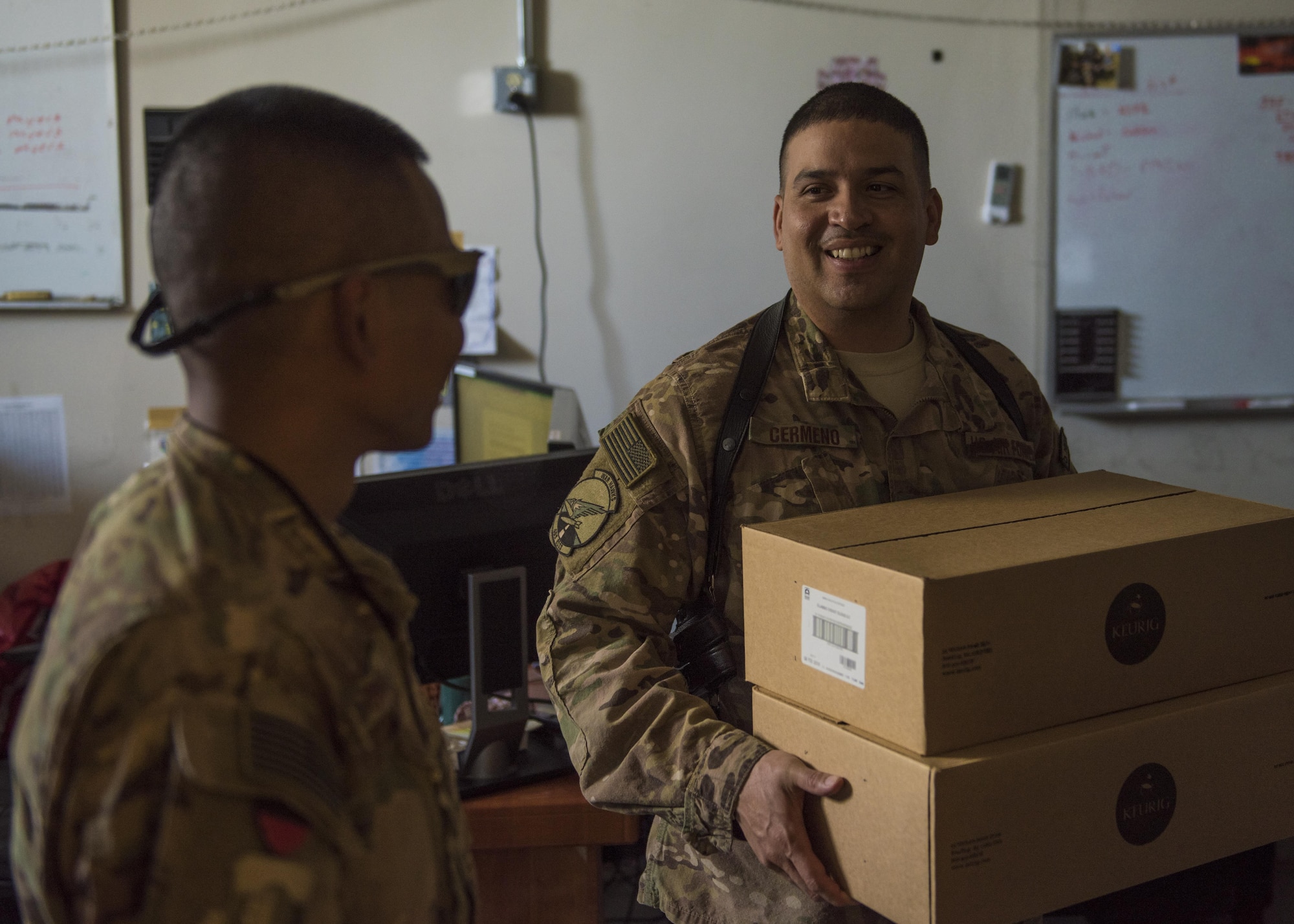 Staff Sgt. Chanreaksmey Sok, 455th Air Expeditionary Wing, chaplain’s assistant, delivers boxes of coffee to the members of 455th Expeditionary Operations Support Squadron, Bagram Airfield, Afghanistan, Aug. 4, 2016. As a way to boost morale and get to know the personnel better, the chaplain team often delivers donated coffee to units around the base. (U.S. Air Force photo by Senior Airman Justyn M. Freeman)