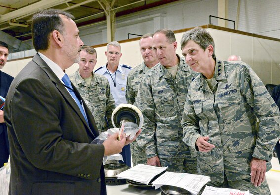 Ralph Garcia, Air Force Life Cycle Management Center director of Propulsion, discusses F107 engine production challenges with Air Force Materiel Command Commander Gen. Ellen Pawlikowski during her visit to Tinker AFB July 18.