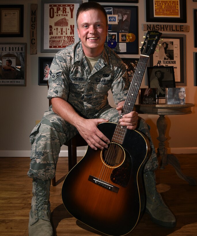 Airman 1st Class Jamie Teachenor, U.S. Air Force Academy Band and Wild Blue Country lead vocalist, displays his gold and platinum records in his home at Peterson Air Force Base, Colo., July 20, 2016.  Air Force photo by Airman 1st Class Dennis Hoffman