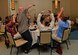 “Team Penguin” celebrates after winning a round in a trivia game during the 1st Special Operations Wing Chaplain Corps resiliency retreat “Rekindling the Romance Date Night” at the Sandestin Hilton in Miramar Beach, Fla., July 28, 2016. Teams were quizzed on their knowledge of historical events, Disney movies and pop culture during the game. (U.S. Air Force photo by Senior Airman Andrea Posey)