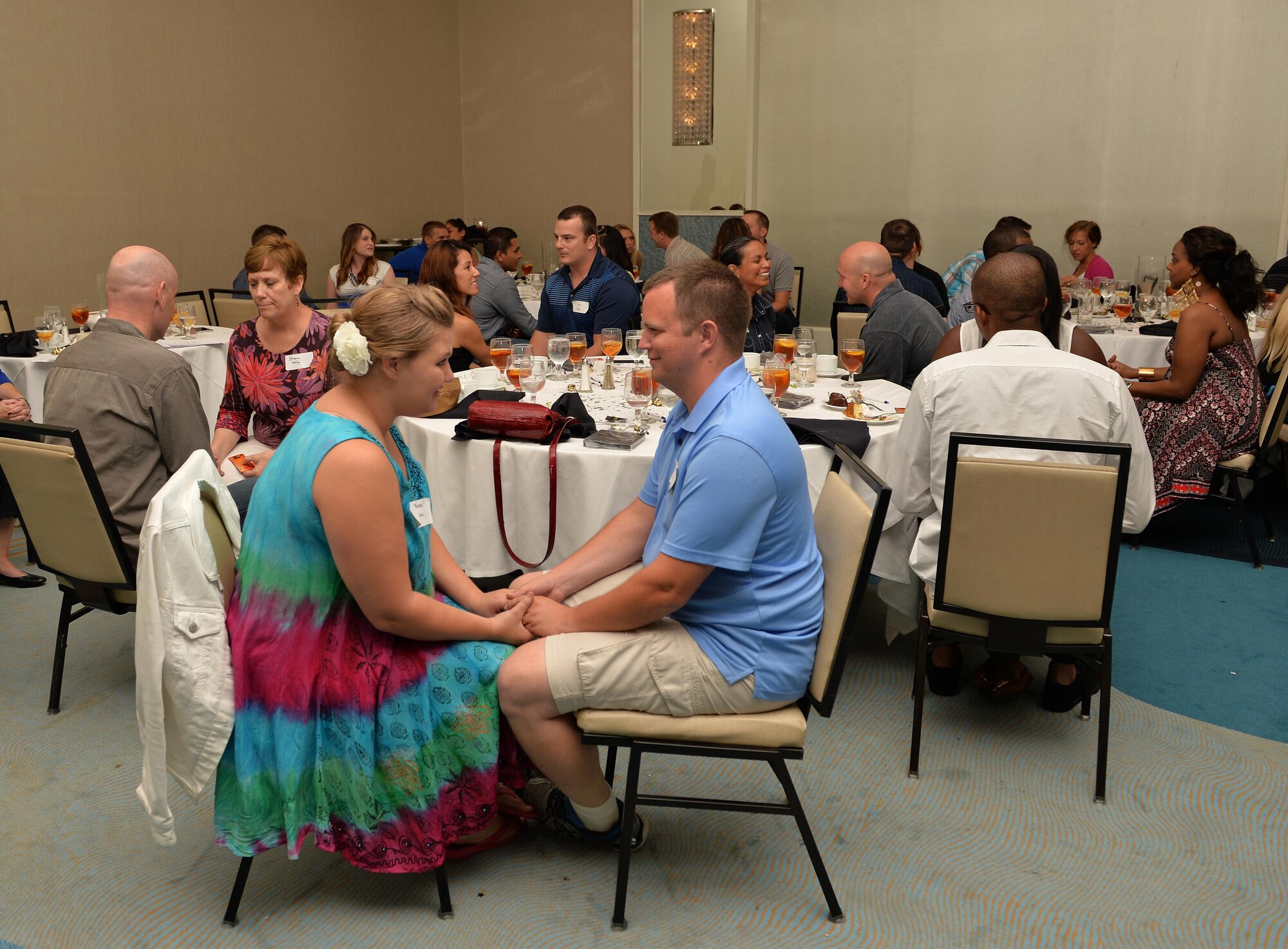 Air Commando couples participate in a communication and connection exercise during the 1st Special Operations Wing Chaplain Corps resiliency retreat “Rekindling the Romance Date Night” at the Sandestin Hilton in Miramar Beach, Fla., July 28, 2016. Couples were encouraged to have appreciative, honest and positive communication with each other during the exercise. (U.S. Air Force photo by Senior Airman Andrea Posey)