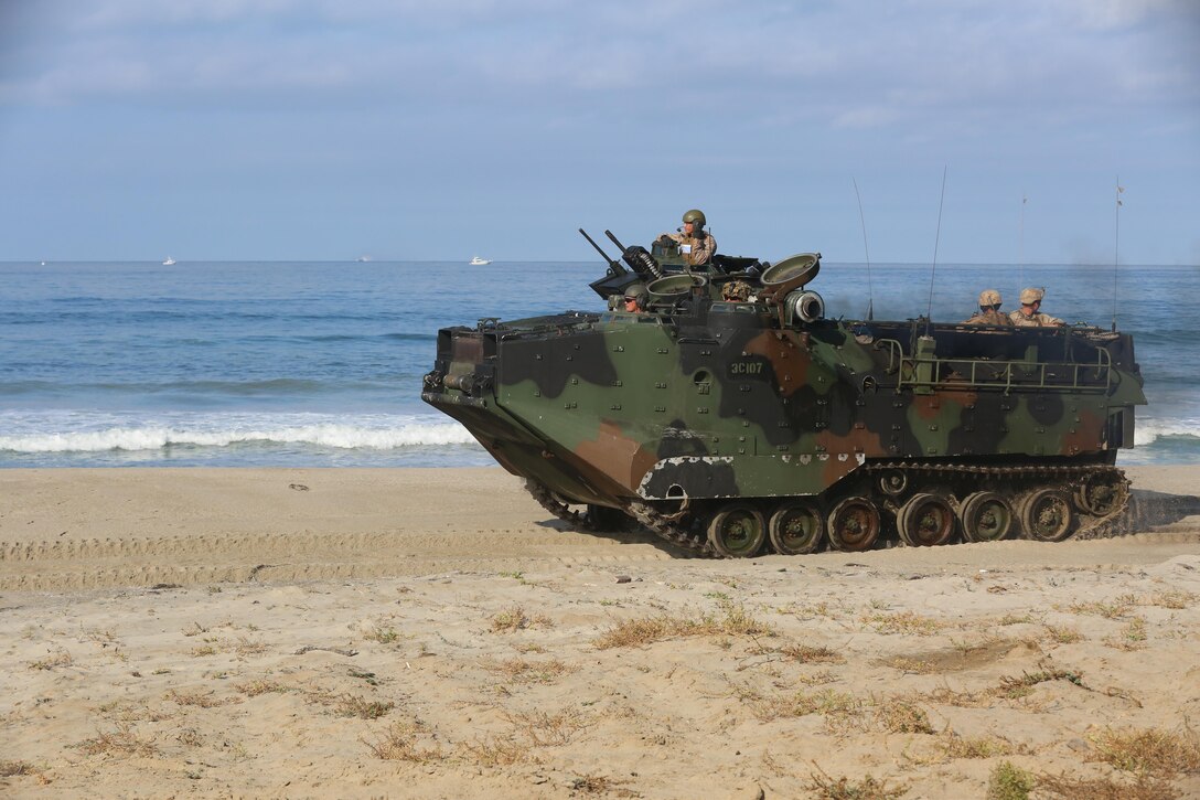 Marines with 3rd Battalion, 1st Marine Regiment, 1st Marine Division execute amphibious assault training during a Marine Corps Combat Readiness Evaluation on Camp Pendleton, Calif., August 2, 2016. During a MCCRE, Marines perform various events to determine the combat readiness of the unit. Maj. James Armstrong, the 3rd Battalion, 1st Marine Regiment executive officer said this was the first time the Marines rode in amphibious assault vehicles. (U.S. Marine Corps photo by Lance Cpl. Shellie Hall)